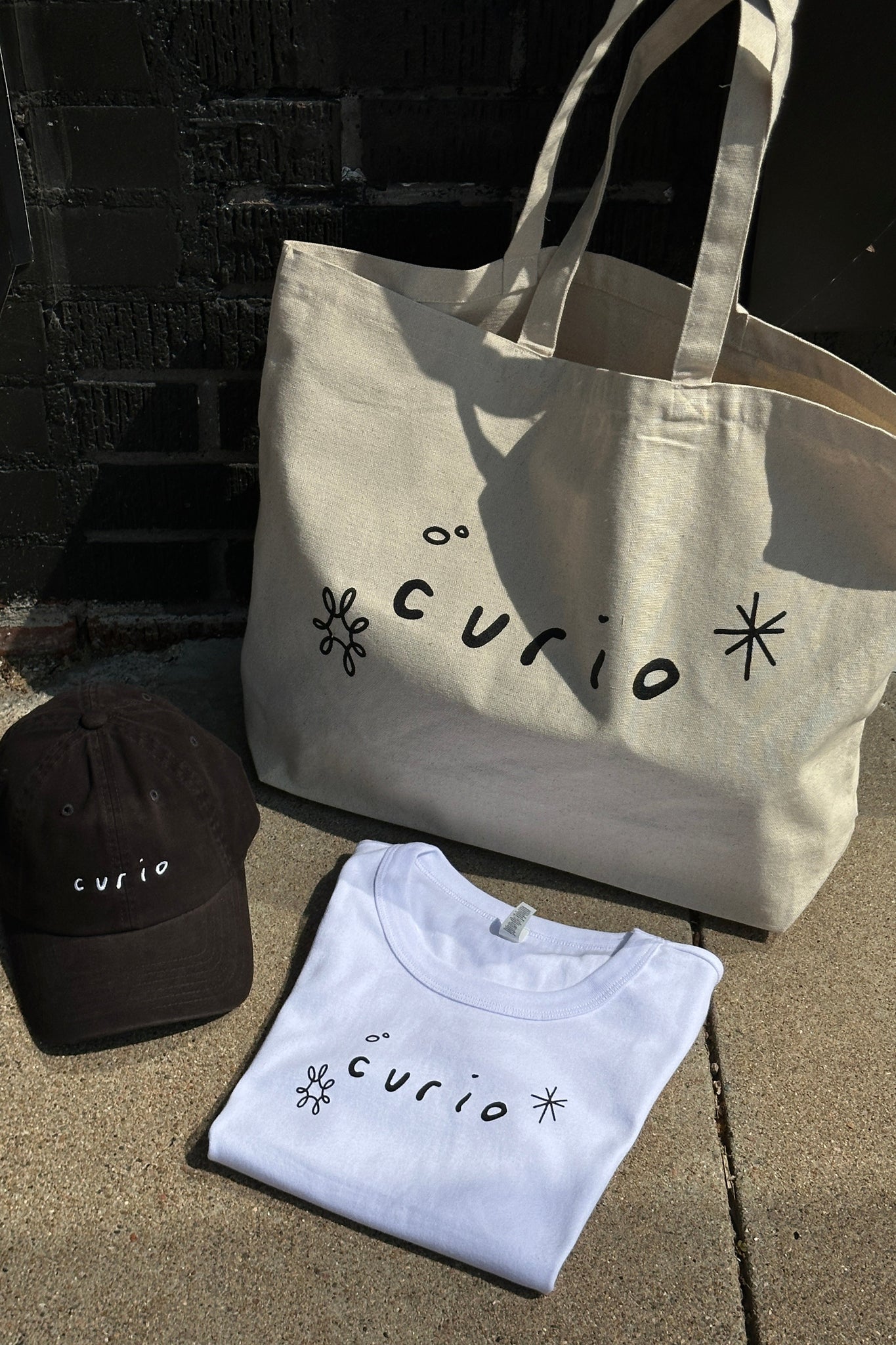 Curio Baby Tee